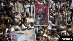 Supporters of the Pakistani religious party Jamiat-e Ulema-e Islam hold pictures of Al-Qaeda leader Osama bin Laden during an anti-U.S. rally on the outskirts of Quetta on May 6.