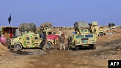 Iraq -- Iraqi pro-government tribal forces hold a position in the Tel Mushaihed area, east of Ramadi, a large city on the Euphrates 100 kilometres (60 miles) west of Baghdad. December 16, 2015