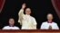 Pope Francis waves from the balcony of St Peter's Basilica during the traditional "Urbi et Orbi" Christmas message to the city and the world, on St Peter's Square in the Vatican on December 25. 