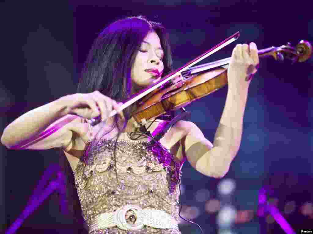 British musician Vanessa-Mae performs during a ceremony to mark the 35th birthday of Ramzan Kadyrov in the Chechen capital, Grozny, in 2011. She acknowledged receiving money for her appearance.