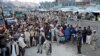 Afghan residents wait at the main border crossing Torkham, between Afghanistan and Pakistan in Nangarhar Province.