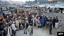 Afghan residents wait at the main border crossing Torkham, between Afghanistan and Pakistan in Nangarhar Province.