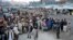 Afghan residents wait at the main border crossing Torkham, between Afghanistan and Pakistan in Nangarhar Province.