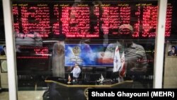 Iranian traders monitor the stock market at the stock exchange in the capital Tehran. FILE PHOTO
