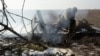 A Ukrainian soldier fires a mortar toward Russian troops at a frontline position near Vuhledar on February 11.