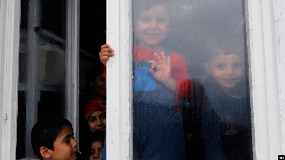 A group of migrant children from Iraq and Afganistan at a center for migrants in eastern Serbia
