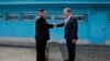 North Korean leader Kim Jong Un (left) shakes hands with South Korean President Moon Jae-in at the border village of Panmunjom in the demilitarized zone on April 27.