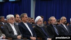 President Hassan Rouhani flanked by parliament speaker Ali Larijani (L) and his deputy Es'haq Jahangiri (R) on May 7, 2016. File photo