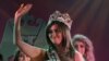 Shayma Qassim waves after winning the Miss Iraq beauty contest in Baghdad.