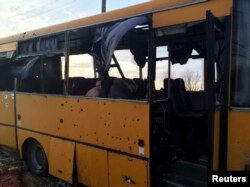 A bus damaged by shelling at a checkpoint of the Ukrainian forces in the village of Bugas, south of Donetsk, on January 13