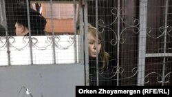 RFE/RL reporter Svetlana Glushkova, detained by police in Astana, Kazakhstan while covering protests, March 22, 2019.