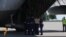 WATCH: At a ceremony at Kharkiv's airport, Ukrainian soldiers load coffins with the remains of those who died in the MH17 crash before it took off for the Netherlands. (Reuters)