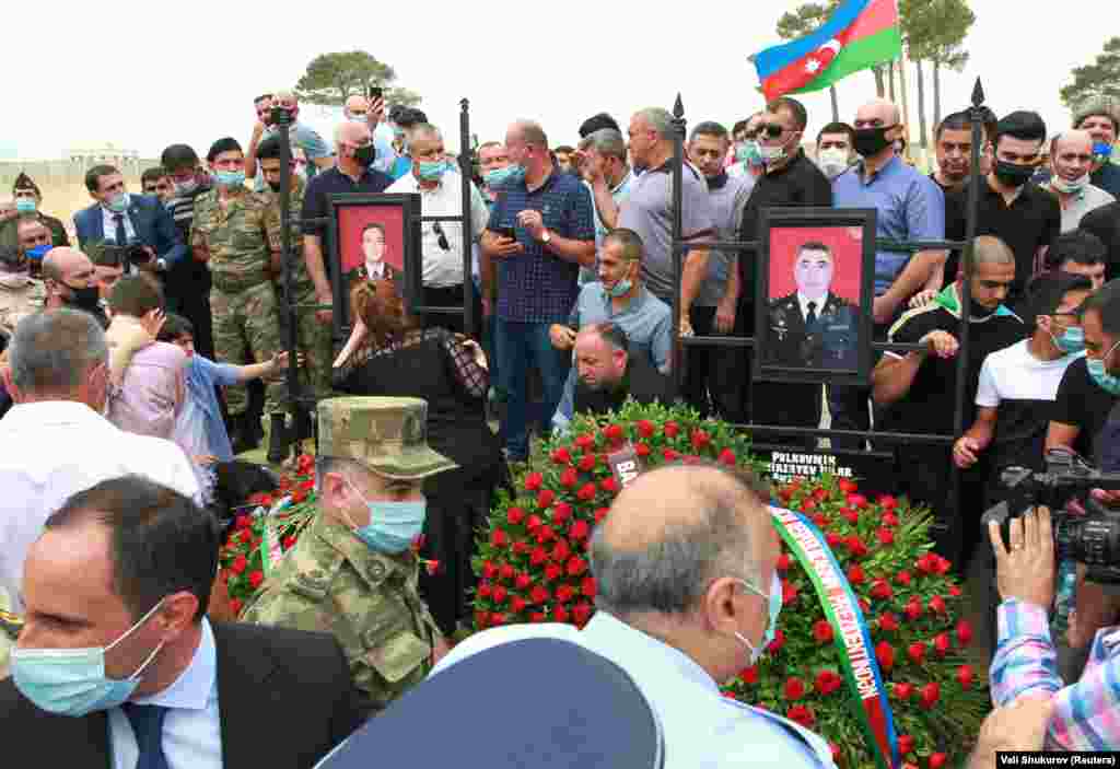 Mourners attend the funeral of Mirzayev and Azerbaijani Major General Polad Gashimov in Baku on July 15.