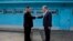 North Korean leader Kim Jong Un (left) shakes hands with South Korean President Moon Jae-in at the border village of Panmunjom in the demilitarized zone on April 27.