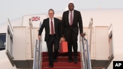 British Prime Minister Keir Starmer (left) and Foreign Secretary David Lammy step from their aircraft on September 12 as they arrive at Joint Base Andrews, Maryland, ahead of talks with U.S. President Joe Biden.