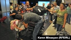 Armenia -- Syrian Armenians arrive in Yerevan, 17Aug2012.