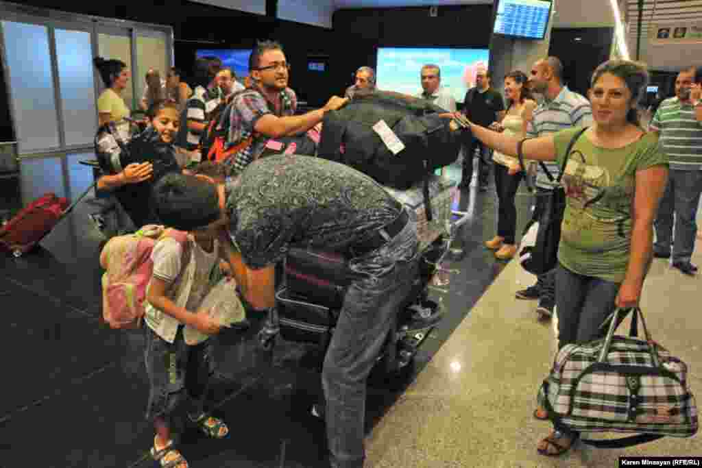 Armenia -- Syrian Armenians arrive in Yerevan, 17Aug2012