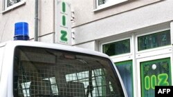 A German police car stands in front of the Islamic Information Center (IIZ) during a raid in Ulm in 2007.