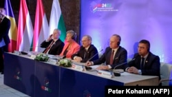 Romanian Vice Prime Minister Catalin Predoiu (left), European Commissioner for Home Affairs Ylva Johansson (second left), Hungarian Interior Minister Sandor Pinter (center), Austrian Interior Gerhard Karner (second right) and Bulgarian Interior Minister Atanas Ilkov attend a press conference on the expansion of the Schengen Area in Budapest on November 22.