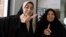 Iranian women display their ink-stained fingers after casting their ballot for the second round of parliamentary elections at a polling station in Robat Karim, some 40 kilometers southwest of the capital, Tehran.