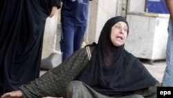 An Iraqi woman weeps at the site of a suicide attack in Baghdad's Karrada district on April 23.