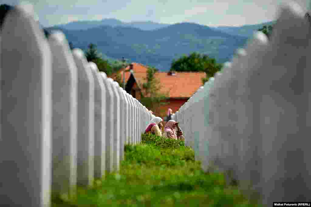 Mourners visit a cemetery in Srebrenica, Bosnia-Herzegovina, on the anniversary of the July 11, 1995 massacre of thousands of Muslim men and boys by Bosnian Serb troops. (Midhat Poturovic, RFE/RL)