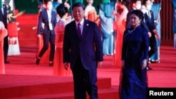 Chinese President Xi Jinping and his wife, Peng Liyuan, arrive for the welcome ceremony for the China-Central Asia summit in Xi'an, China, on May 18.