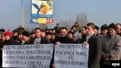 Demonstrators in Moldova call for the removal of checkpoints controlled by Russian troops after the fatal shooting of an 18-year-old man at the Vadul Iui Voda checkpoint on January 1.