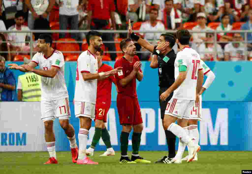 Soccer Football - World Cup - Group B - Iran vs Portugal - Mordovia Arena, Saransk, Russia - June 25, 2018 Portugal's Adrien Silva remonstrates with referee Enrique Caceres as a penalty decision is referred to VAR REUTERS/Murad Sezer