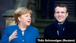 Cancelarul Germaniei, Angela Merkel și președintele francez Emmanuel Macron la 22 ianuarie 2019 la Aachen