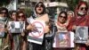 PAKISTAN -- Supporters of Pakistan political party Tehreek-e-Insaf (PTI) shout slogans during a demonstration against French President Macron's comments over Prophet Muhammad caricatures, in Hyderabad, October 29, 2020