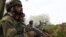 FILE: Indian soldiers look on during clashes between suspected rebels and Indian forces in Badgam district south of the regional capital Srinagar.