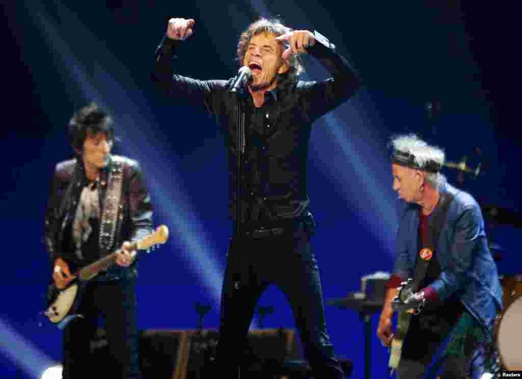 Ronnie Wood, Mick Jagger, and Keith Richards (left to right) of the British rock band The Rolling Stones perform during a California stop on their &quot;50 &amp; Counting&quot; worldwide tour. (Reuters/Mike Blake)