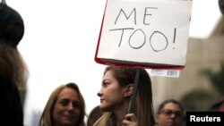 USA -- People participate in a "MeToo" protest march for survivors of sexual assault, Los Angeles. November 12, 2017.