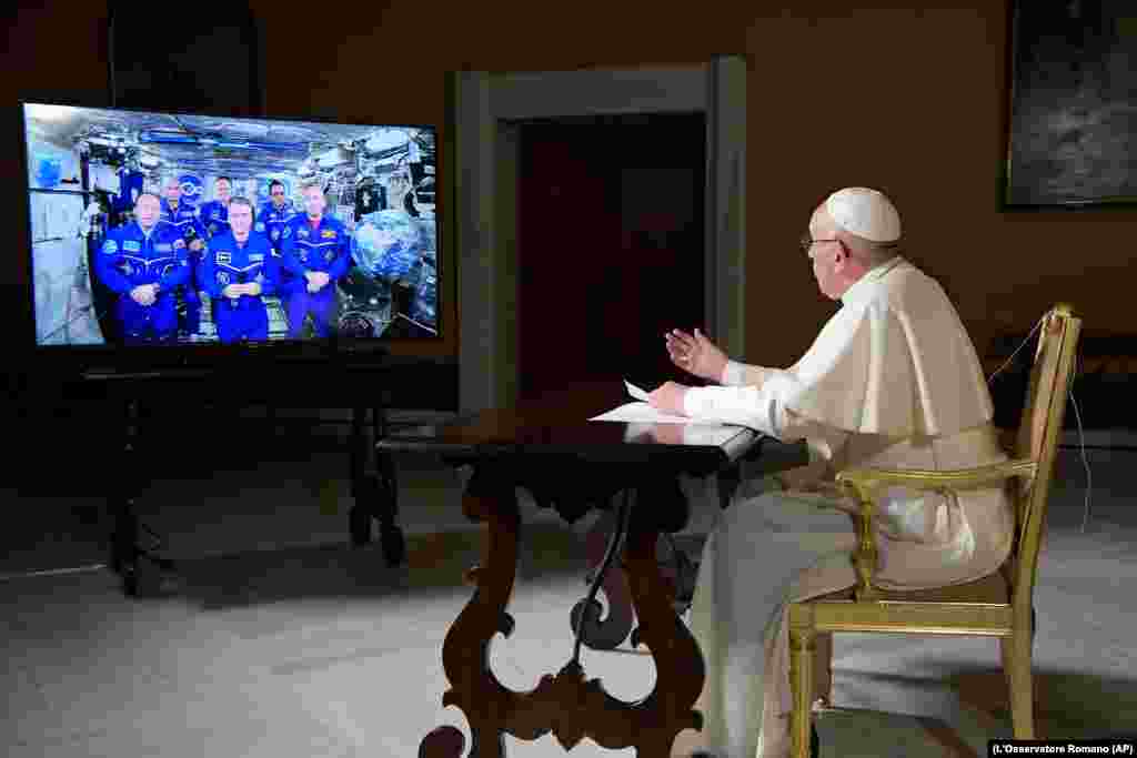 Pope Francis speaks to the crew aboard the International Space Station from the Vatican on October 26. (L'Osservatore Romano/Pool Photo via AP)
