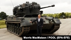 German Chancellor Olaf Scholz poses in front of a Gepard tank on August 25, 2022.