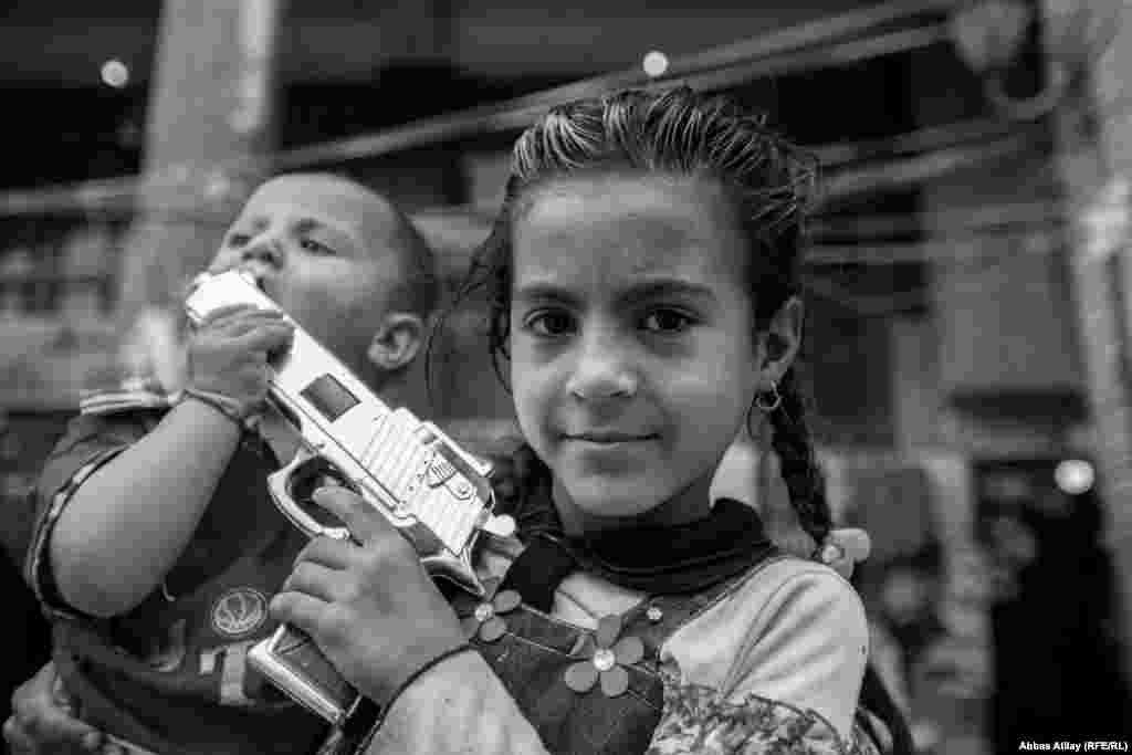 These children are accompanying their parents on a visit to holy shrines in Karbala, but their attention is elsewhere.