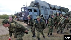 Soldiers near an S-300 surface-to-air missile complex during joint Russian-Belarusian military exercises in September 2009