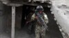 Members of the Afghan security forces take position during an operation against the Islamic State in Khot district of Nangarhar Province, on July 26.