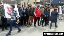 Gonabadi Dervishes gather outside a Tehran police station on February 19 to protest the arrest of one of their number, Nematollah Riahi, 72, who they said had come to the city to help protect Nurali Tabandeh and his home.