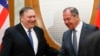 Russian Foreign Minister Sergei Lavrov (right) welcomes U.S. Secretary of State Mike Pompeo for talks in the Black Sea city of Sochi on May 14. 