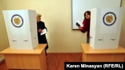 Armenia -- Voters cast ballots at a polling station in Yerevan during a presidential election, 18Feb2013.