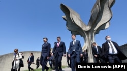 Croatian Prime Minister Andrej Plenkafterovic (left), President Zoran Milanovic (center), and parliament speaker Gordan Jandrokovic leave the flower-shaped Jasenovac monument after a ceremony in tribute to the victims killed in the concentration camp during World War II on April 22, 2020.