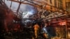 First responders search for survivors at the scene of an explosion at the Sina At'har health centre in the north of Iran's capital Tehran northern Tehran on June 30, 2020. - 