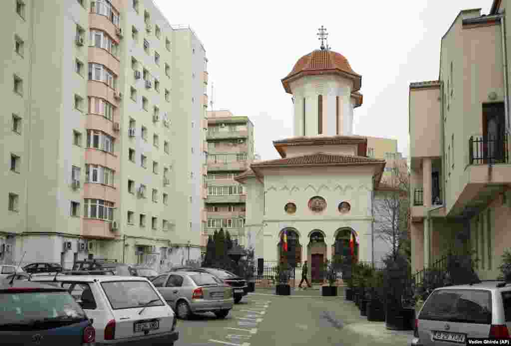 A man walks past Olari Orthodox Church on January 6, 2019.