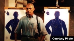 Isakhan Ashurov, pictured here at a Miami police academy during a 2002 visit to the United States, routinely receives death threats because of the controversial nature of the cases he takes on.