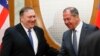 Russian Foreign Minister Sergei Lavrov (right) welcomes U.S. Secretary of State Mike Pompeo for talks in the Black Sea city of Sochi on May 14. 