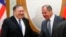 Russian Foreign Minister Sergei Lavrov (right) welcomes U.S. Secretary of State Mike Pompeo for talks in the Black Sea city of Sochi on May 14. 