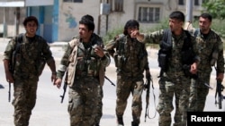 Kurdish fighters from the People's Protection Units (YPG) 