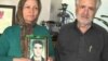 Akram Neghabi, standing next to her husband, Hashem Zeinali, holds a photograph of her son Saeed Zeinali, who has been missing since 1999.